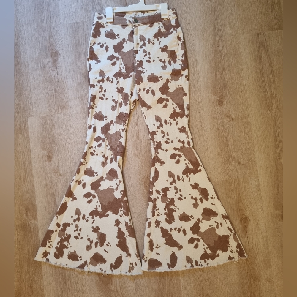 Cow printed bell bottom jeans